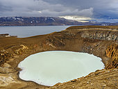The small volcanic lake called Viti in volcano Askja. Lake Oeskjuvatn in the background. The north eastern interior highlands of Iceland in the Vatnajoekull National Park, a UNESCO world heritage site. Europe, Northern Europe, Iceland