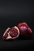 Pomegranate (Punica granatum) on black background