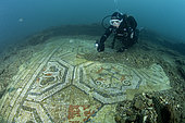 Scuba diver exploring a polychrome mosaics in the thermal complex of Lacus Baianus, Marine Protected Area of Baia, Naples, Italy, Tyrrhenian Sea