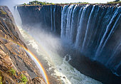 Victoria Falls. A general view with a rainbow. National park. Mosi-oa-Tunya National park. and World Heritage Site. Africa. Zambiya. Zimbabwe.