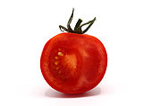 Half ripe red tomato on a light background. Natural product. Natural color. Close-up.