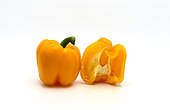 Sweet yellow pepper whole and in a cut on a light background. Natural product. Natural color. Close-up.