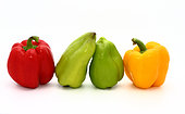 Four sweet ripe peppers of red, green and yellow color on a light background. Natural product. Natural color. Close-up.