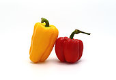 Two sweet peppers of yellow and red color on a light background. Natural product. Natural color. Close-up.