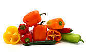 Composition of several sweet peppers and their halves of different colors on a light background. Natural product. Natural color. Close-up.