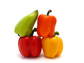 Composition of several types of sweet pepper of different shapes, colors and sizes on a light background. Natural product. Natural color. Close-up. [dump] =>