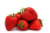 Several ripe strawberries on a light background. Natural color and shape. Close-up.