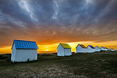 Beach huts in Gouville sur mer at sunset, Manche, Cotentin, France