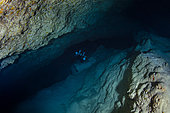 Go to the dark. My friend Olivier "leads the way" down to the deepest point of the cave. Underwater cave, Mayotte
