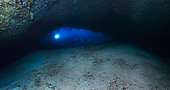 The exit. Panorama of the exit of the cave. Photo taken at a depth of 55 metres. You can see the sand bank that has been accumulating for thousands of years at the entrance to the cave. Underwater cave, Mayotte