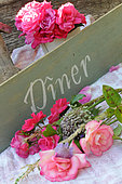 Emera Roses and other varieties, grey sign 'Dinner' message
