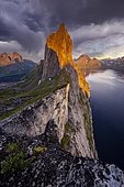 Dramatic clouds, evening mood, steep mountain Segla, fjord Mefjords with mountains, island Senja, Troms, Norway, Europe