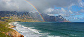 View with rainbow towards Rooi Els and Hanklip from Clarence Drive on the eastern side of False Bay. Cape Town, Western Cape, South Africa.