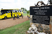 School bus at the entrance of the park. The government is encouraging pupils to discover fauna in order to better protect it. Maasai Mara national park. Kenya.