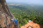 Tourists on the staircase going to the summit of the Lion's rock, former capitale of king Kasyapa from 477 to 495. Sirigiya. Sri-Lanka.