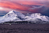 Ship in a Norwegian fjord in winter. North Atlantic Ocean