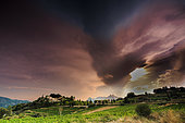 Village of Suzette under a stormy sky, in the Dentelles de Montmirail, Vaucluse, France