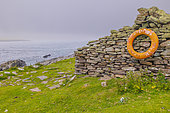 Ruin and lifebuoy, Bressay Island, opposite Noss Island, Shetland, Scotland