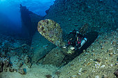 Rebreather diver exploring the propeller of the Chrisoula K, “The Tile Wreck” Abu Nuhas, Egypt. Strait of Gubal, Gulf of Suez, Red Sea