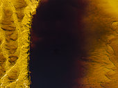 Detail of the Rio Tinto (Red river) with its deep reddish hue due to oxidised iron minerals in its water. Aerial view. Drone shot. Huelva province, Andalusia, Spain.
