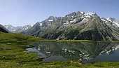Meije Massif at the beginning of the summer and Pontet lake, Ecrins National Park, Alps, France