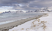 Ytresand Beach near village Fredvang, view over to island Flakstadoya. The island Moseknesoya, the Lofoten islands in northern Norway during winter. Europe, Scandinavia, Norway, February