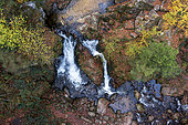 The small Tendon waterfall in autumn, aerial view, Vosges, France.