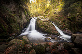 The small Tendon waterfall in autumn, Vosges, France.