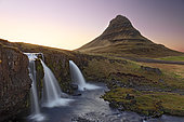 Kirkjufell mountain at sunset, mountain against clear sky and a waterfall in foreground, Western Region, Iceland