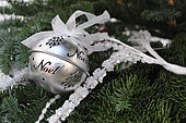 Christmas ball with ribbon, festive decoration, tree and garland