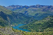 On the way down from the Peña Foratata, view of the lake of the Lanuza dam and the Tendenera mountain range (2847m), Aragonese Pyrenees, Spain