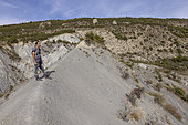 Luc Ebbo, paleontologist, observing the blue marls of the Albian of Sisteron. Ebbo collection