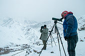 Spotters looking for the snow leopard, Himalayas, Rumbak village, Ladakh, India