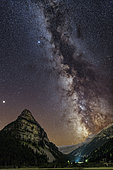 Milky Way in the sky of the Southern Alps above the Tour des Sagnes, in Ubaye, night sky at new moon, in summer, very low light pollution region. Jupiter shines on the left. Alpes de Haute-Provence, France
