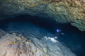 Diver at the bottom of an underwater cave 75 metres deep and which has been flooded for thousands of years (- 20 000 years). Mayotte