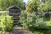 Handmade insect house in a garden in spring, Pas de Calais, France
