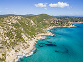 Aerial view of the coastline and the turquoise waters between Cap Taillat and the Pointe du Canadel in the background, Ramatuelle, Var, France