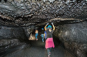 Tourists in the lava tunnels, Reunion Island, France