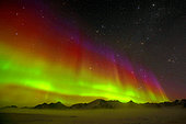 Aurora borealis on Kioldind fjord, Cape Hoegh, north-east coast of Greenland