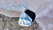 Iceberg breaking off the pack ice, East coast of Greenland