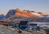 Little Inuit village Tinit (Tiilerilaaq) at the shore of the Sermilik (Sermiligaaq) icefjord in the area Ammassalik in East Greenland. North America, Greenland, Ammassalik, Danish territory, autumn
