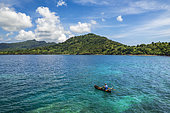 Fisherman in a pirogue in the lagoon, Handréma, Mayotte