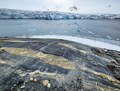 Islet of metamorphic rock polished by the ancient movements of a glacier, Dahlbreen, Spitsbergen, Svalbard archipelago