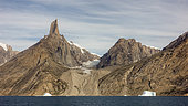 Mountain landscape in Scoresby Sound, Greenland, with icebergs drifting in the Ofjord at the foot of Grundtvigskirken.
