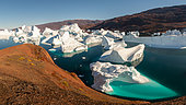 Iceberg graveyard landscape near Rode Island in Scoresby Sound, Greenland