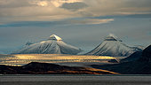 Landscape of mountains (the "crowns") and glaciers at sunset in King's Bay, island of Spitsbergen, Svalbard archipelago