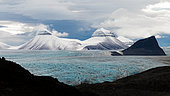 Landscape of snow-capped mountains and glaciers in King's Bay, island of Spitsbergen, Svalbard archipelago