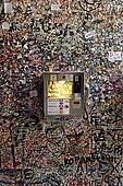 Tourist information phone and graffiti at the entrance to Juliet's House, Verona, Veneto, Italy