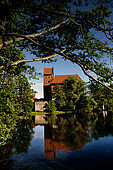 Trakai, Lithuania: the right side of the insular castle (Traku pilis) reflected on the water of the Galves lake;