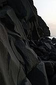 Italy, Sicily, Stromboli island. Lunga beach, lava rock formation